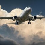A commercial airplane flying through dramatic clouds, showcasing aviation in action.